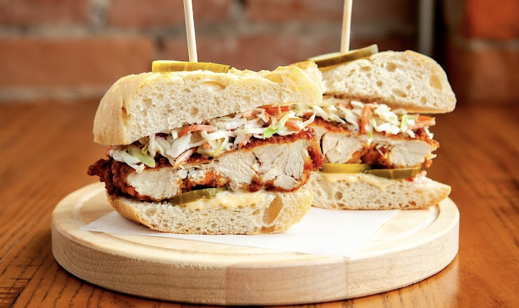 The Eagle signature dishes Fried Chicken SandwichMac and CheeseHush Puppies